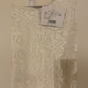 Brand new dalia white lace long sleeves dress from Melanie Lyne